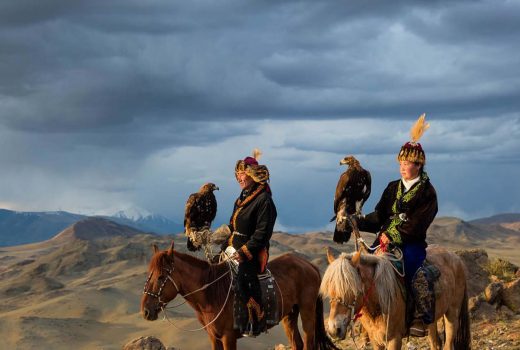 Eagle hunter and model father Nurgaiv with his eagle huntress doughter Aisholpan